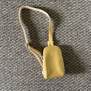 Yellow crossbody/mini backpack. Brand new never used. NEICOA
